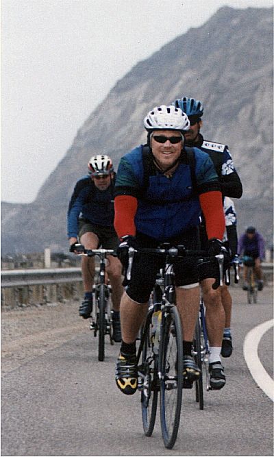 RDM riding along the highway on the Calfornia AIDSRide 2002